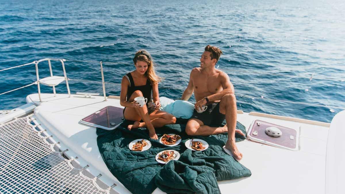 Couple enjoy lunch on Yacht Getaways catamaran